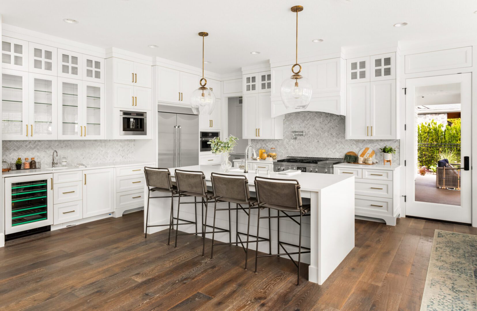 Modern kitchen with white cabinets and island.