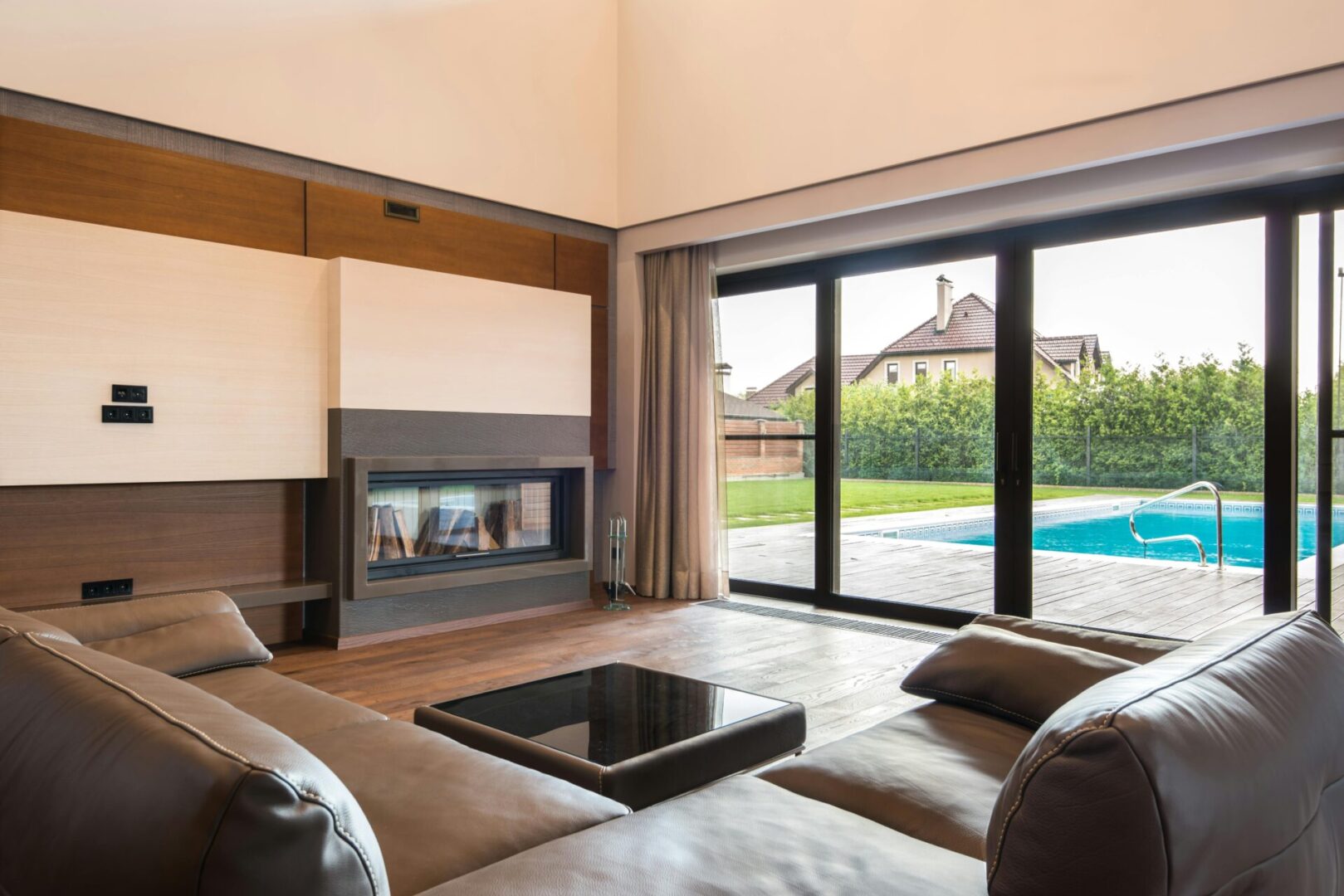 Modern living room with pool view.