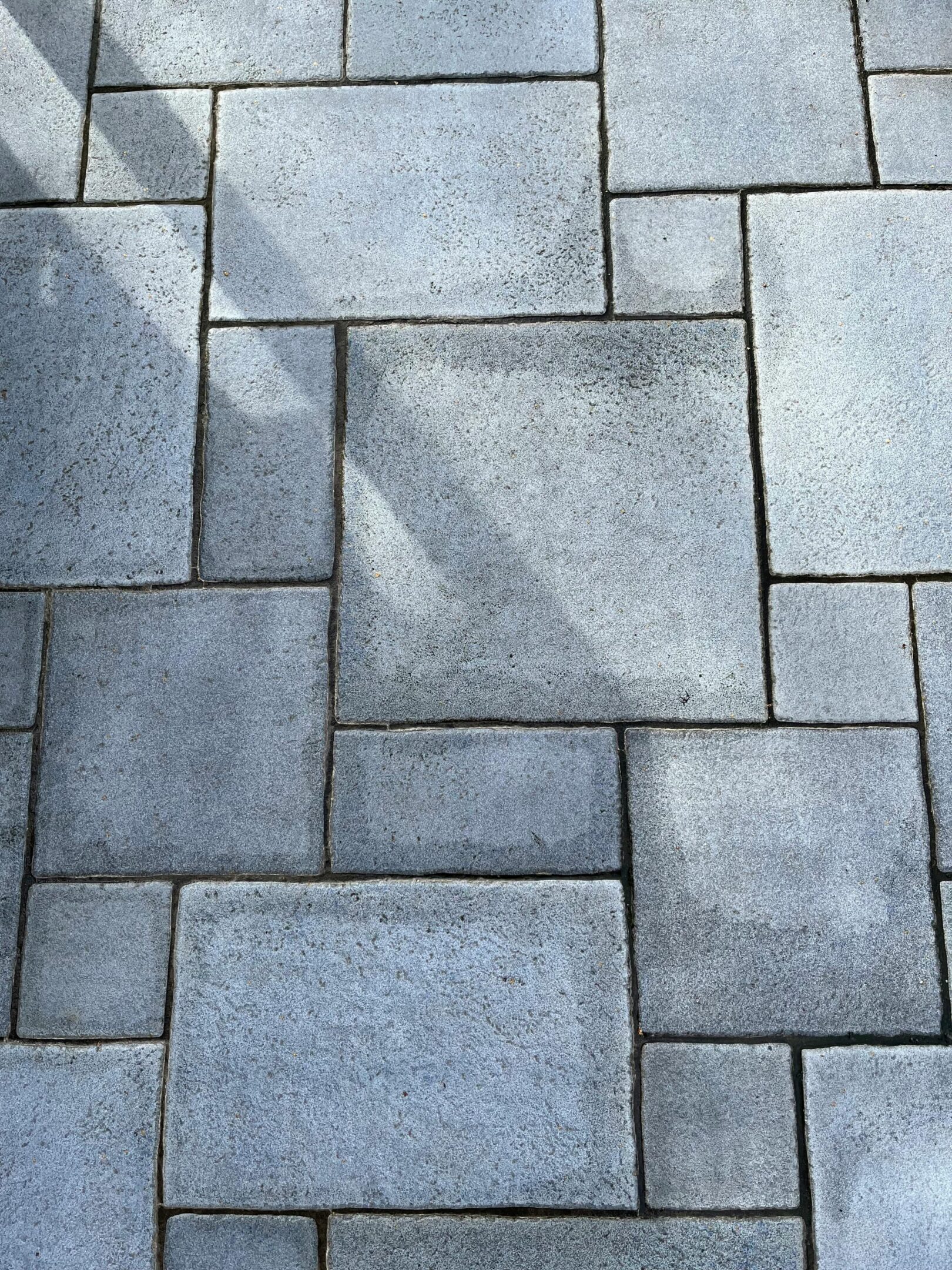 Gray stone paving with shadow pattern.